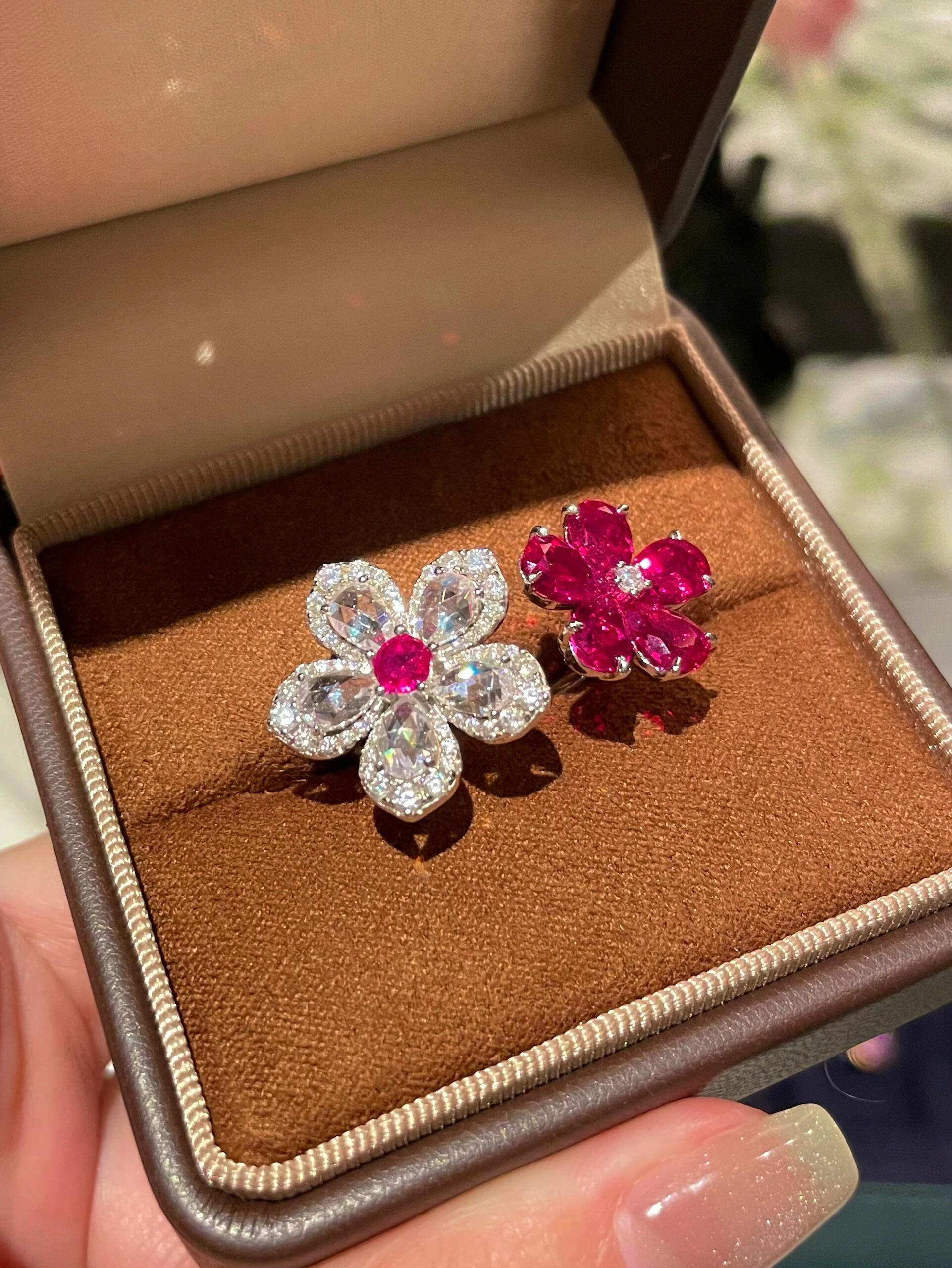 Close-up of Blooming Ember ruby flower ring capturing gemstone brilliance and gold finish – ÉCLI
